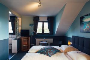 Postel nebo postele na pokoji v ubytování FETZ DAS LORELEY HOTEL