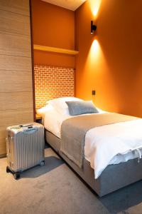 Postel nebo postele na pokoji v ubytování B-Lodge Boutique Hôtel