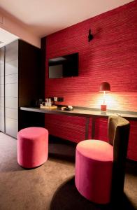 TV a/nebo společenská místnost v ubytování B-Lodge Boutique Hôtel