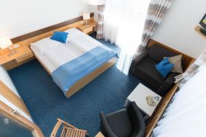 Кровать или кровати в номере Sonnenhügel