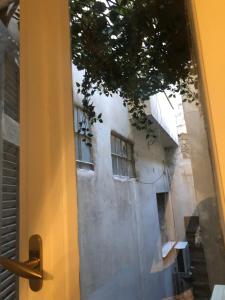 an open door with a view of a building at Syntagma private sweet safe double rooms with shared bathroom in Athens