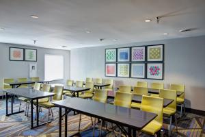 a classroom with tables and chairs in a room at Holiday Inn Express Columbus South - Obetz, an IHG Hotel in Obetz