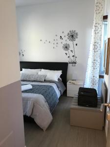 Posteľ alebo postele v izbe v ubytovaní ValpoHome&Rooms