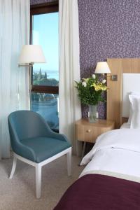Postel nebo postele na pokoji v ubytování Masel Hotel