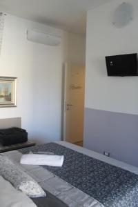 TV a/nebo společenská místnost v ubytování ValpoHome&Rooms