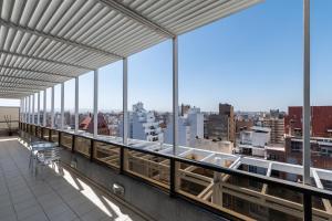 a balcony with a view of a city at AT Suites in Córdoba