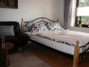 Cama ou camas em um quarto em Ferienwohnung Schmidt