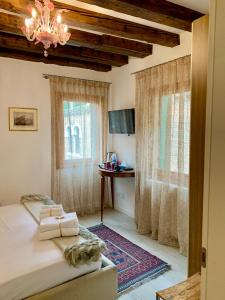 TV a/nebo společenská místnost v ubytování B&B Fortuny