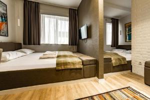 Postel nebo postele na pokoji v ubytování Belgrade Inn Garni Hotel