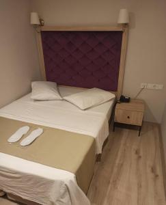 Postel nebo postele na pokoji v ubytování Cadde Suite Bakırköy