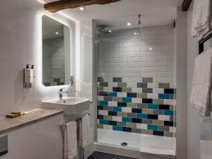 a bathroom with a sink and a shower at The Feathers Hotel in Ludlow