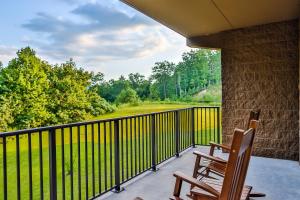 a patio area with benches and a fence at Glades View Condos in Gatlinburg