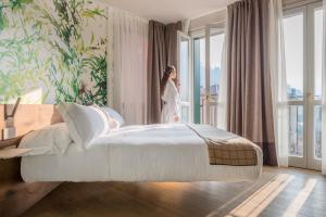 Postel nebo postele na pokoji v ubytování QC Room San Pellegrino