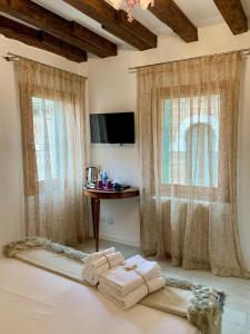 Postel nebo postele na pokoji v ubytování B&B Fortuny