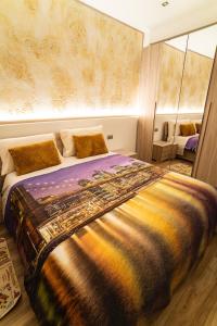 En eller flere senger på et rom på Carrara Deluxe Home