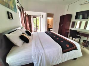 Postel nebo postele na pokoji v ubytování Astana Swaha Villa