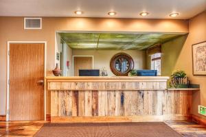 a bar in a home with a wooden fence at Rory & Ryan Inn in Burns