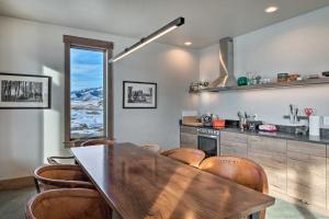 a kitchen with a wooden table and some chairs at Secluded Paradise Valley Retreat with Stunning Views in Livingston