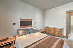 a bedroom with a large bed and a wooden dresser at Secluded Paradise Valley Retreat with Stunning Views in Livingston