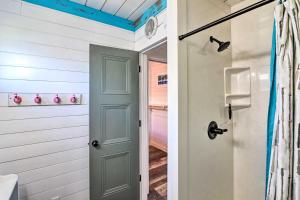 a bathroom with a door leading to a closet at 2 Blocks to Surfside Beach A-Frame Home with Deck in Surfside Beach +16 photos
