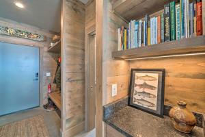 a room with wooden walls and a book shelf with books at Secluded Paradise Valley Retreat with Stunning Views in Livingston