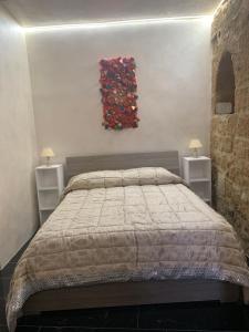 Postel nebo postele na pokoji v ubytování Orvieto inn.... Mary