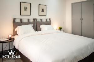 Postel nebo postele na pokoji v ubytování Hôtel Royal Urban Concept + 37 fotografií