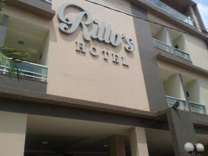 a building with a sign on the side of it at Rillos Hotel in Altamira