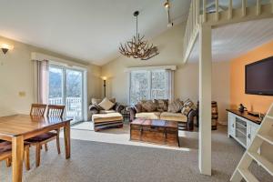a living room with a couch and a table at Condo with Loft 2 Mi to Windham Mountain Ski! in Windham