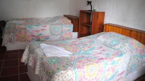 Voodi või voodid majutusasutuse Hostal Galapagos by Bar de Beto toas