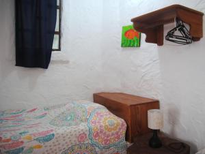 Voodi või voodid majutusasutuse Hostal Galapagos by Bar de Beto toas