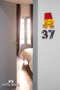 Postel nebo postele na pokoji v ubytování Hôtel Royal Urban Concept