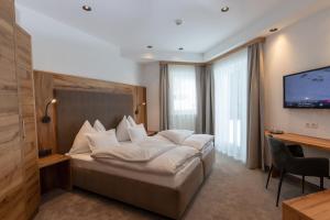 Postel nebo postele na pokoji v ubytování Hotel Neder
