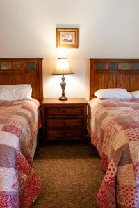 Postel nebo postele na pokoji v ubytování Circle R Motel