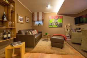 a living room with a couch and a chair at Große Wies in Oberstdorf