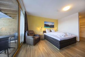 Postel nebo postele na pokoji v ubytování Hotel Krimml