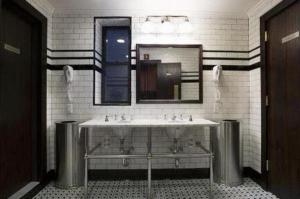 a bathroom with a sink and a mirror at The Jane Hotel in New York