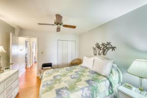 a bedroom with a bed and a ceiling fan at Our Time in Myrtle Beach