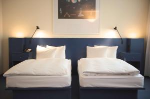 Postelja oz. postelje v sobi nastanitve Radisson Blu Fürst Leopold Hotel