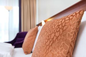 a close up of a pillow in a hotel room at Radisson Blu Park Hotel & Conference Centre in Dresden