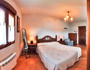 Posteľ alebo postele v izbe v ubytovaní El Mirador Apartamentos