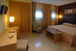 Łóżko lub łóżka w pokoju w obiekcie Hotel Macami