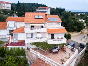 an aerial view of a house with orange roofs at Apartments Bajcic in Rab