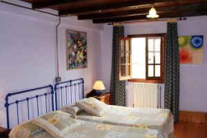 Postel nebo postele na pokoji v ubytování Casas Rurales Pradina I y II