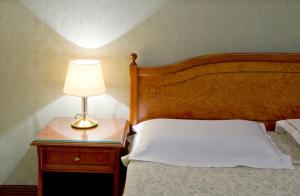 Voodi või voodid majutusasutuse Hotel Skala toas