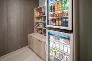a refrigerator filled with lots of food and drinks at Holiday Inn Express Hotel & Suites Watsonville, an IHG Hotel in Watsonville