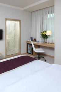 Postel nebo postele na pokoji v ubytování Masel Hotel