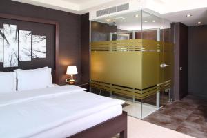Postel nebo postele na pokoji v ubytování Masel Hotel