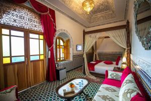 A bed or beds in a room at Palais Houyam