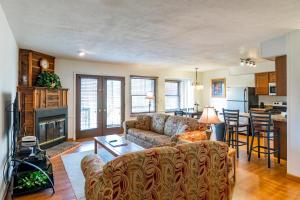 a living room with a couch and a fireplace at Crown Resorts at Silverwoods in DuBois